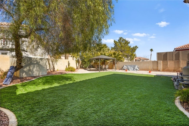 view of yard with a fenced backyard, a patio, and a gazebo