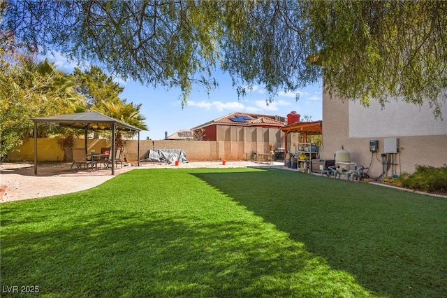 view of yard with a patio area and a fenced backyard