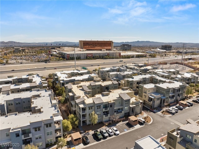 aerial view with a mountain view and a city view