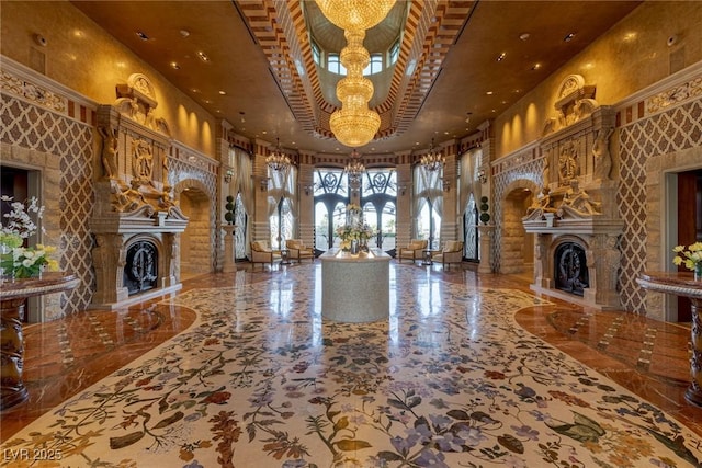 9101 Alta Dr Unit 1206, Las Vegas, NV 89145 - unfurnished living room with a fireplace, a towering ceiling, a chandelier, arched walkways, and recessed lighting