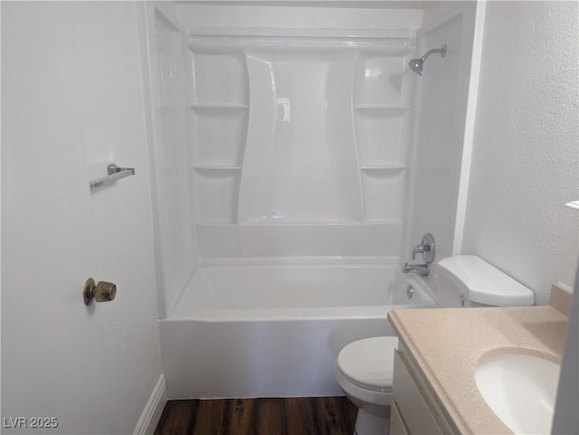 full bathroom with shower / bath combination, a textured wall, toilet, vanity, and wood finished floors