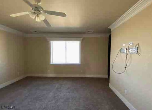 unfurnished room featuring a ceiling fan, visible vents, crown molding, and baseboards