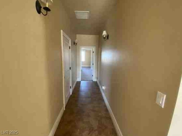 hall featuring baseboards