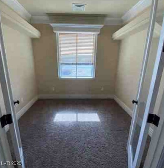 interior space featuring visible vents and dark carpet