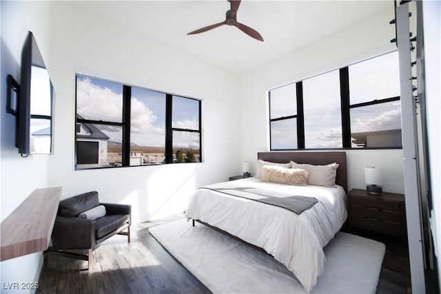 bedroom featuring ceiling fan and wood finished floors