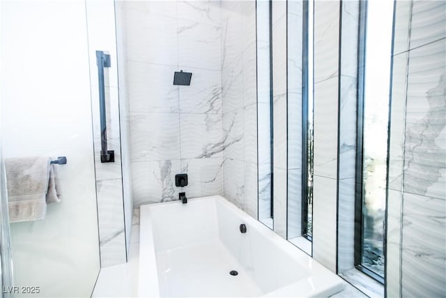 bathroom featuring a shower and a tub