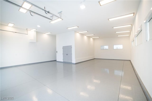 garage featuring baseboards