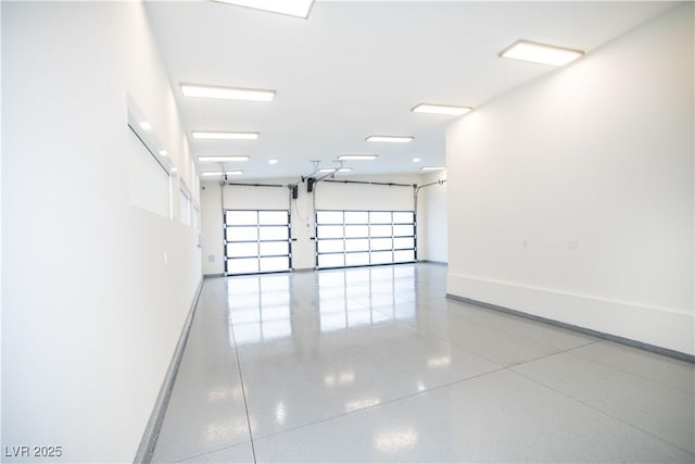 garage featuring baseboards