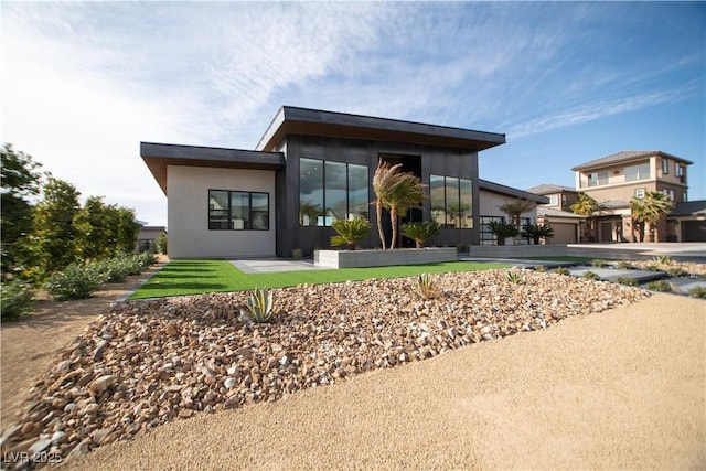 view of front of house featuring stucco siding