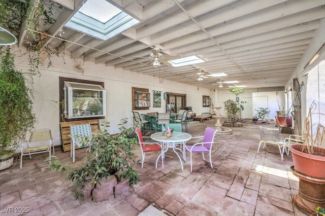 view of patio featuring outdoor dining space and ceiling fan