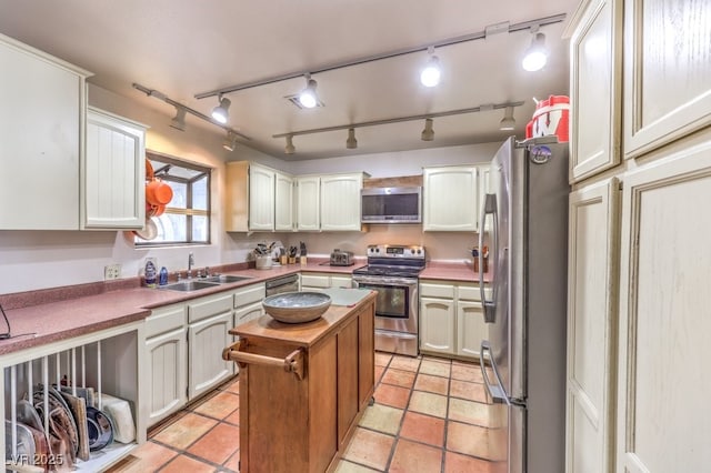 kitchen with appliances with stainless steel finishes and a sink