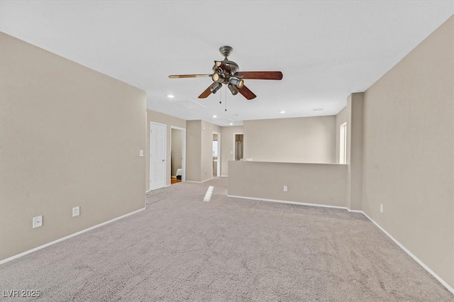 unfurnished room featuring recessed lighting, light carpet, ceiling fan, and baseboards