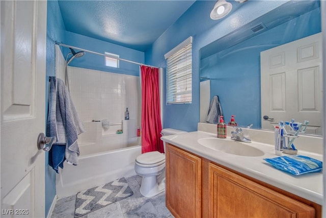 full bath with plenty of natural light, shower / bath combination with curtain, toilet, and vanity