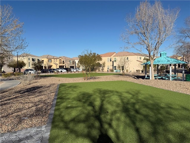 view of yard with a gazebo and a residential view