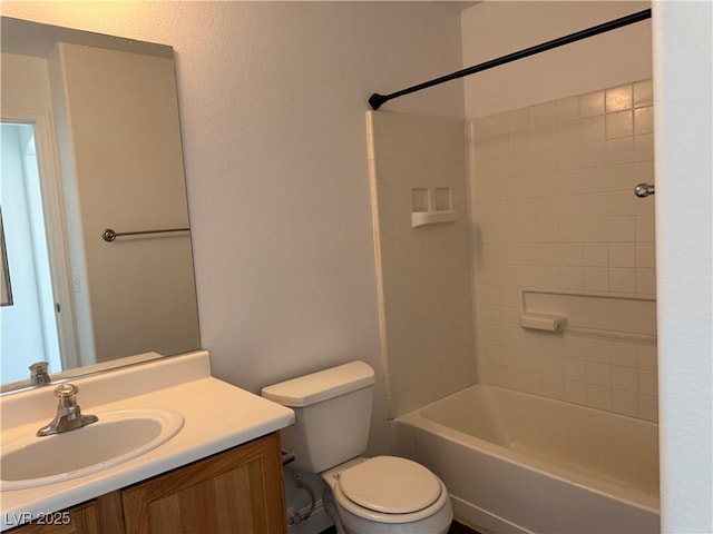 bathroom featuring vanity, toilet, and shower / bathtub combination