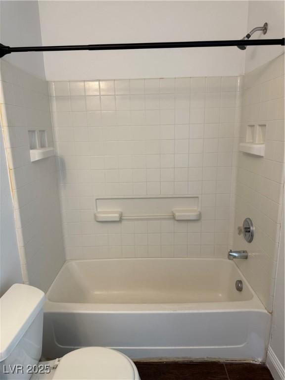 bathroom with toilet and shower / bathtub combination