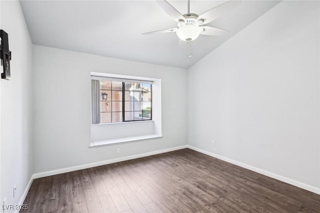 empty room featuring dark wood finished floors, a ceiling fan, and baseboards