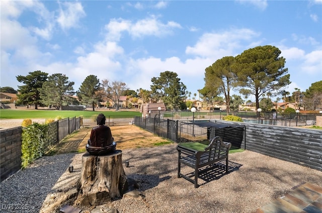 surrounding community with a residential view, fence, and a pool