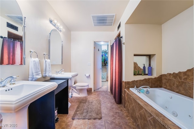 bathroom featuring a whirlpool tub, toilet, tile patterned flooring, and visible vents