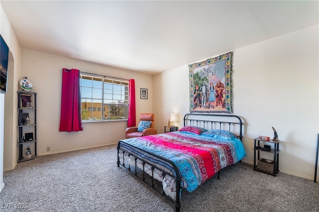 carpeted bedroom featuring baseboards