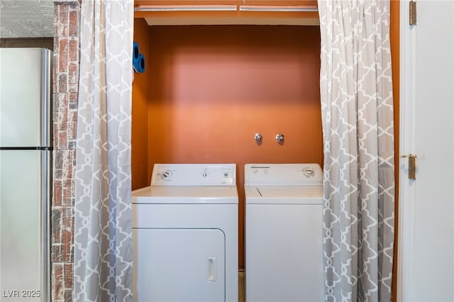 clothes washing area with laundry area and separate washer and dryer