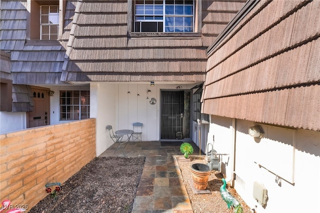 doorway to property with a patio area