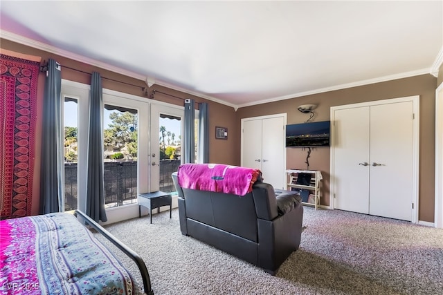 bedroom featuring carpet, french doors, two closets, ornamental molding, and access to outside