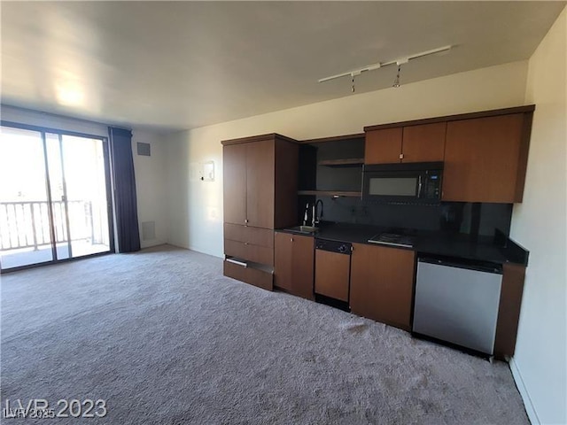 kitchen featuring open shelves, dark countertops, stainless steel dishwasher, a sink, and black microwave