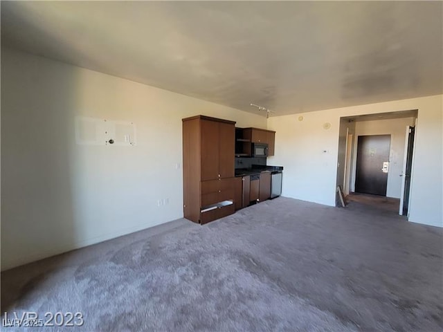 unfurnished living room with dark carpet