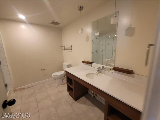 full bathroom featuring a stall shower, baseboards, visible vents, toilet, and vanity