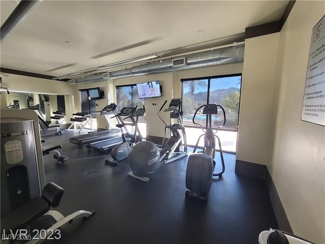 workout area with baseboards and visible vents