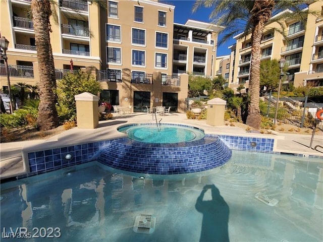 pool with a community hot tub