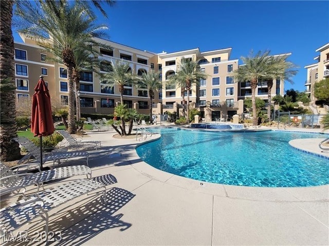 community pool featuring a patio area