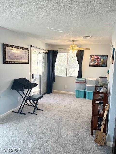 2240 Highpointe Dr Unit 201, Laughlin, NV 89029 - carpeted office featuring a textured ceiling, baseboards, and ceiling fan