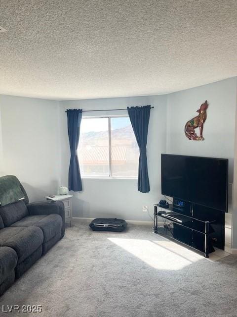 carpeted living room featuring a textured ceiling and baseboards