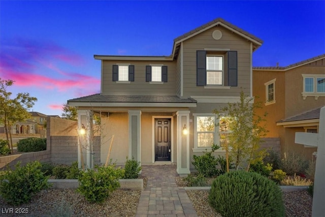 traditional-style house with stucco siding