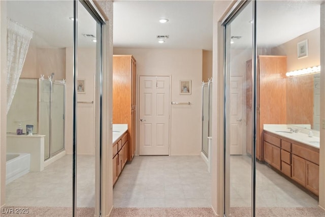 full bathroom with a garden tub, visible vents, vanity, a shower stall, and tile patterned floors