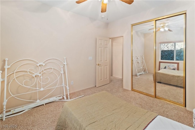 carpeted bedroom featuring a closet and ceiling fan