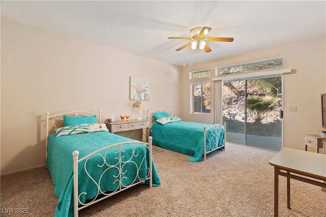 carpeted bedroom featuring access to outside and a ceiling fan