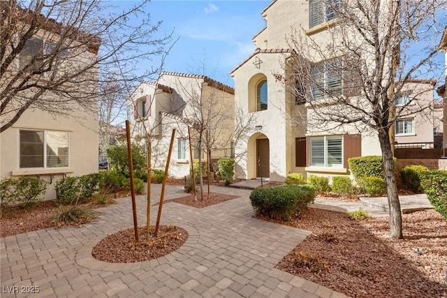 view of front of house featuring a patio area and stucco siding