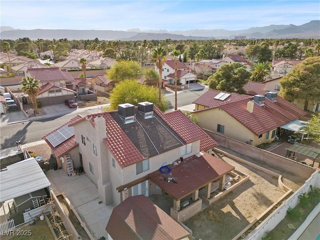 drone / aerial view with a residential view and a mountain view