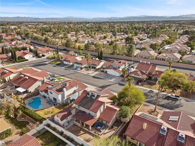 birds eye view of property with a mountain view and a residential view