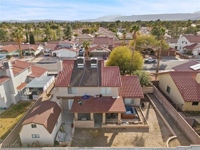 birds eye view of property featuring a mountain view and a residential view