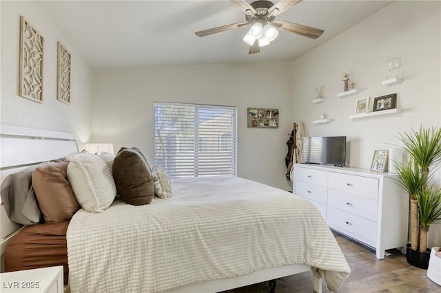 bedroom featuring lofted ceiling, ceiling fan, and wood finished floors