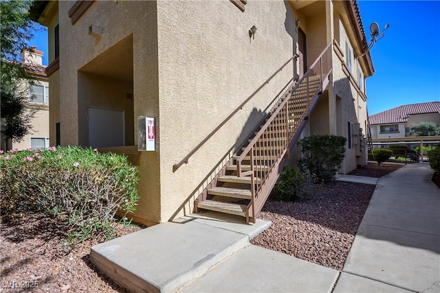 property entrance featuring stucco siding