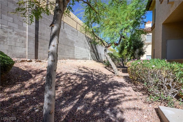 view of home's exterior with fence and stucco siding