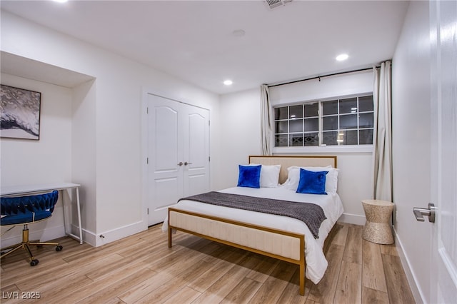 bedroom featuring recessed lighting, wood finished floors, visible vents, and baseboards