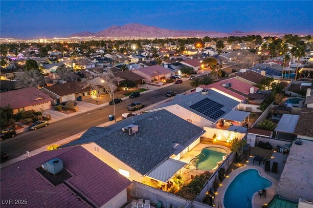 drone / aerial view with a residential view and a mountain view