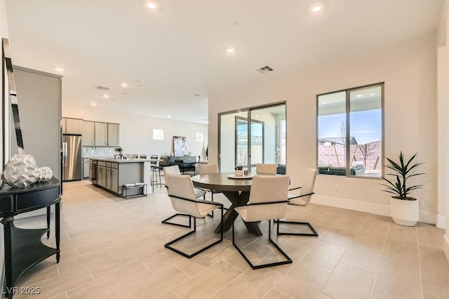 dining room with recessed lighting, visible vents, and baseboards