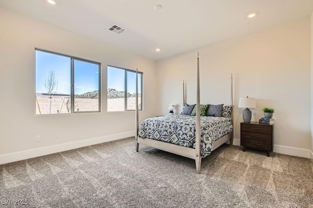 carpeted bedroom featuring recessed lighting, visible vents, and baseboards